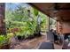 Spacious patio with seating area overlooking a serene garden at 1038 E Michigan St # 1, Orlando, FL 32806