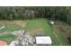 Property view showing outbuildings and open land at 1111 Sunflower Trl, Orlando, FL 32833