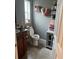 Bathroom with toilet, sink vanity, and decorative towel storage at 1111 Sunflower Trl, Orlando, FL 32833