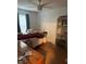 Cozy bedroom with a bed, desk, and shelving at 1111 Sunflower Trl, Orlando, FL 32833