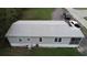 Single-wide mobile home with grey siding and AC unit at 1111 Sunflower Trl, Orlando, FL 32833