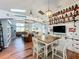 Open concept dining area with custom shelving and wood flooring at 16146 Egret Hill St, Clermont, FL 34714