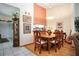Formal dining room with wood table and chairs, hardwood floors, and adjacent kitchen at 3 Escondido Cir # 18, Altamonte Springs, FL 32701