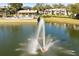 Tranquil fountain with a rainbow, adding a touch of serenity to the lake at 3 Escondido Cir # 18, Altamonte Springs, FL 32701