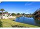 Serene lakefront view with lush landscaping and community amenities at 3 Escondido Cir # 18, Altamonte Springs, FL 32701