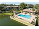 Community pool with lake views and plenty of space for relaxation at 3 Escondido Cir # 18, Altamonte Springs, FL 32701