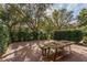 Brick patio with rustic wood picnic table at 8745 Via Bella Notte, Orlando, FL 32836