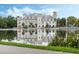 Stunning lake view of a waterfront community building at 1020 Siena Park W Blvd # 303, Celebration, FL 34747