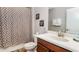 Bathroom with shower/tub combo and single vanity at 1431 Thunderbird Rd, Davenport, FL 33896