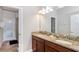 Double vanity bathroom with granite countertops at 1431 Thunderbird Rd, Davenport, FL 33896