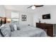 Bedroom with king-size bed and dresser at 1431 Thunderbird Rd, Davenport, FL 33896