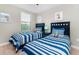 Bedroom with twin beds and playful decor at 1431 Thunderbird Rd, Davenport, FL 33896