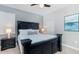 Bedroom with king-size bed and ocean-themed art at 1431 Thunderbird Rd, Davenport, FL 33896