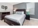 Bedroom with queen-size bed and modern decor at 1431 Thunderbird Rd, Davenport, FL 33896