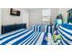 Bedroom with twin beds, dresser, and TV at 1431 Thunderbird Rd, Davenport, FL 33896