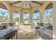 Relaxing gazebo with tables overlooking a resort-style pool at 1431 Thunderbird Rd, Davenport, FL 33896