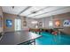 Basement game room features ping pong, foosball, and air hockey tables at 1431 Thunderbird Rd, Davenport, FL 33896
