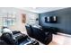 Spacious home theater with comfortable seating and large TV at 1431 Thunderbird Rd, Davenport, FL 33896
