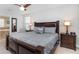 Main bedroom with king-size bed and ensuite bathroom at 1431 Thunderbird Rd, Davenport, FL 33896