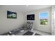 Home gym with weights, step-up platform, and window overlooking the backyard at 2842 Moulin Rd, Davenport, FL 33837
