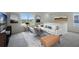 Spacious living room with large windows, sectional sofa, and a coffee table at 2842 Moulin Rd, Davenport, FL 33837