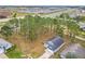 Aerial view showcasing home and surrounding trees at 308 Halstead Dr, Davenport, FL 33897