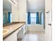 Bathroom boasts a garden tub, shower, and double vanity at 308 Halstead Dr, Davenport, FL 33897