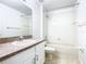 Clean bathroom with a tub, shower, and updated vanity at 308 Halstead Dr, Davenport, FL 33897
