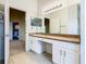 Bathroom with double vanity and view into another room at 308 Halstead Dr, Davenport, FL 33897