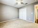 Spacious bedroom with double door closet and ceiling fan at 308 Halstead Dr, Davenport, FL 33897