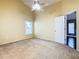 Bright bedroom featuring a window with blinds and ceiling fan at 308 Halstead Dr, Davenport, FL 33897