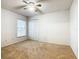 Simple bedroom with neutral walls, carpet, and ceiling fan at 308 Halstead Dr, Davenport, FL 33897