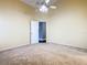 Spacious bedroom with carpeted floor and ceiling fan at 308 Halstead Dr, Davenport, FL 33897