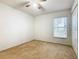 Well-lit bedroom featuring a window with blinds and ceiling fan at 308 Halstead Dr, Davenport, FL 33897