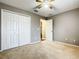 Bright bedroom featuring a double door closet and ceiling fan at 308 Halstead Dr, Davenport, FL 33897