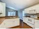 Modern kitchen featuring white cabinets and a breakfast bar at 308 Halstead Dr, Davenport, FL 33897