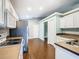 Updated kitchen with stainless steel appliances and wood floors at 308 Halstead Dr, Davenport, FL 33897