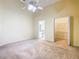 Spacious primary bedroom with carpet, large closet and ensuite bath at 308 Halstead Dr, Davenport, FL 33897