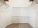Large walk-in closet with wire shelving for ample storage at 308 Halstead Dr, Davenport, FL 33897