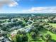 Aerial view of a community with houses and green spaces at 3904 Plantation Blvd, Leesburg, FL 34748
