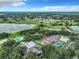 Aerial view of community amenities including pool and tennis courts at 3904 Plantation Blvd, Leesburg, FL 34748