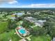 Aerial view of community amenities including pool and tennis courts at 3904 Plantation Blvd, Leesburg, FL 34748
