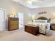 Main bedroom with king-size bed and ensuite access at 3904 Plantation Blvd, Leesburg, FL 34748
