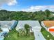 Single-story home with gray roof, two-car garage, and landscaped yard at 3904 Plantation Blvd, Leesburg, FL 34748