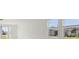 Spacious bedroom with large windows and neutral walls at 4702 Jasmine Cir, Leesburg, FL 34748