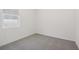 Bedroom with carpet, window, and neutral walls at 4702 Jasmine Cir, Leesburg, FL 34748