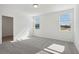 Bright bedroom featuring carpet flooring and two large windows at 4702 Jasmine Cir, Leesburg, FL 34748