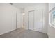 Bedroom with carpet, sliding doors, and window at 4702 Jasmine Cir, Leesburg, FL 34748