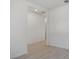 Bright hallway with tile floors and neutral walls at 4702 Jasmine Cir, Leesburg, FL 34748