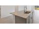 Kitchen island with granite countertop and double sink at 4702 Jasmine Cir, Leesburg, FL 34748